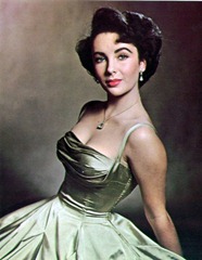 elizabeth-taylor-almost-17-sits-for-photographer-phillippe-halsman-in-a-decollete-evening-dress-of-gold-silk-387x500
